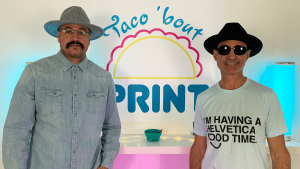 Gal Shweiki and Joey Dominguez standing in front of the Taco bout Print logo.