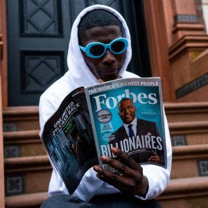In a story about special ad sections man reading a forbes magazine