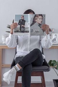 In a story about the power of print ad sales a woman reading a magazine
