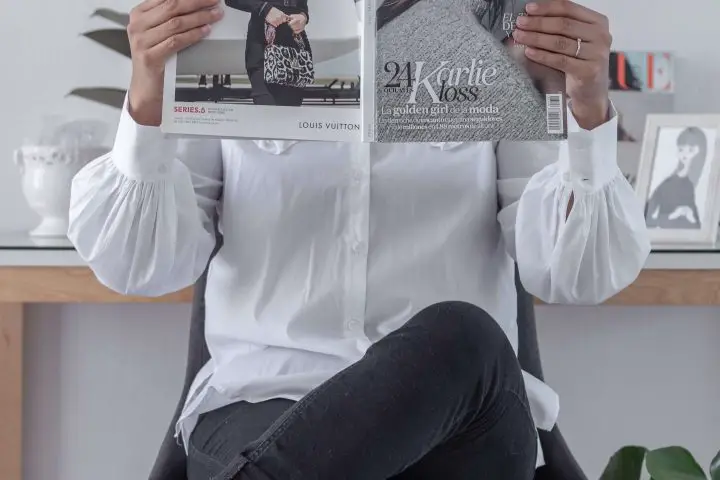 In a story about the power of print ad sales a woman reading a magazine